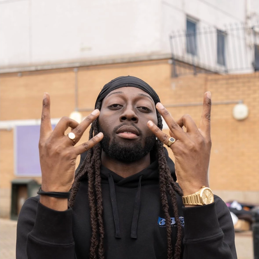 Confz in a black hoodie, photographed outdoors in London
